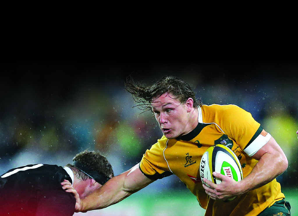 OUTTA MY WAY: Wallabies captain Michael Hooper fends off All Black Wyatt Crockett last Saturday. OUTTA MY WAY: Wallabies captain Michael Hooper fends off All Black Wyatt Crockett last Saturday.
